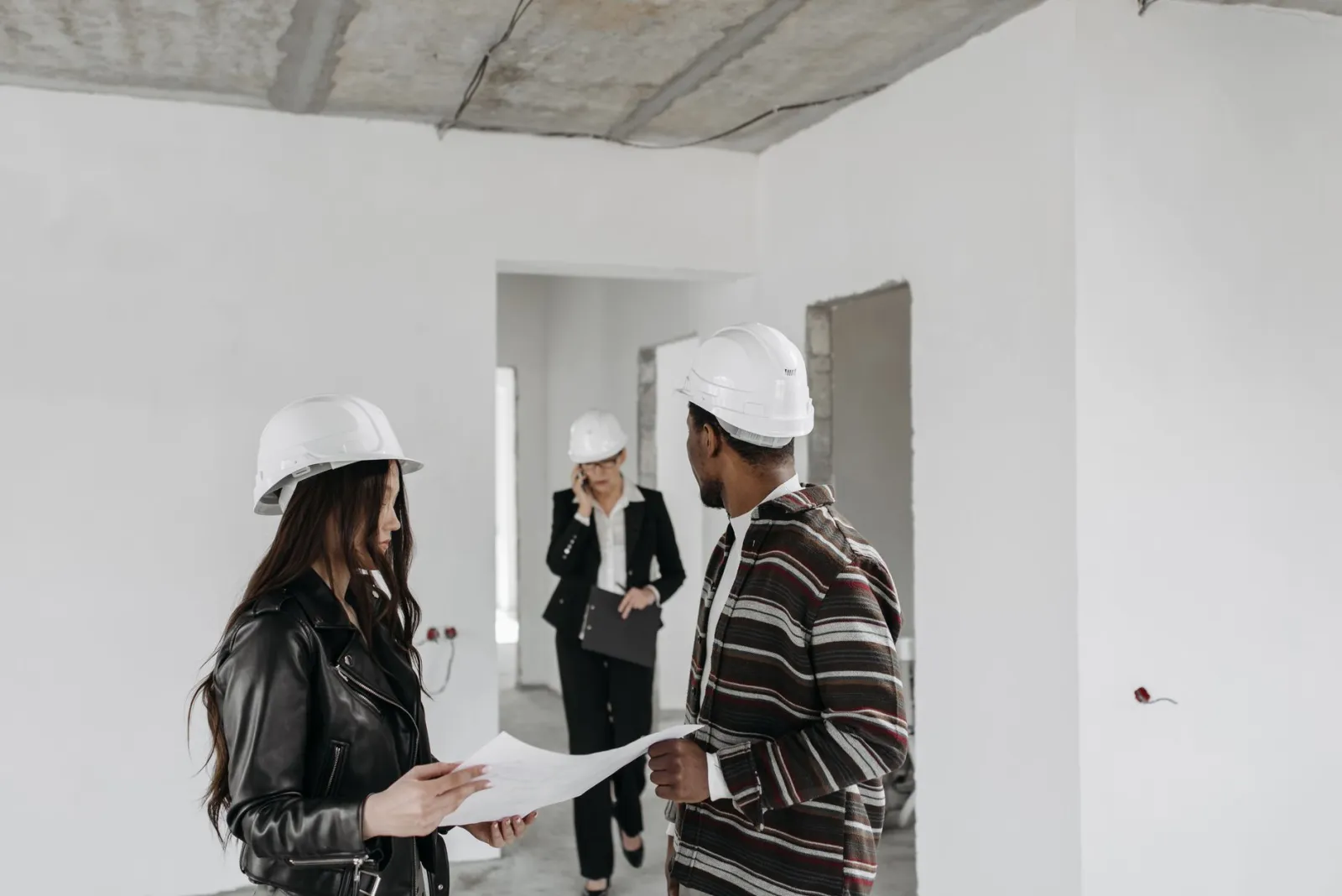Homeowner and contractor reviewing a quote together at a job site
